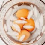 soft boiled eggs chilling in an ice bath