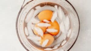 soft boiled eggs chilling in an ice bath