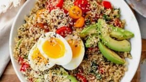 quinoa, eggs, tomatoes and avocado in a bowl