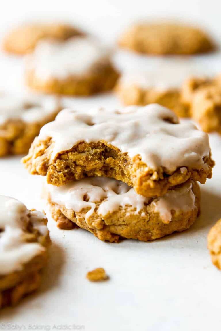 two brown butter oatmeal cookies with maple icing