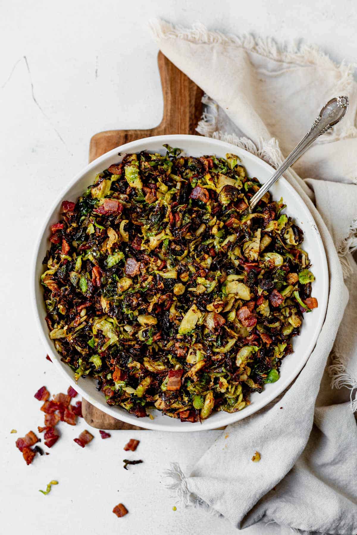 brussels sprout hash in a serving bowl with a spoon