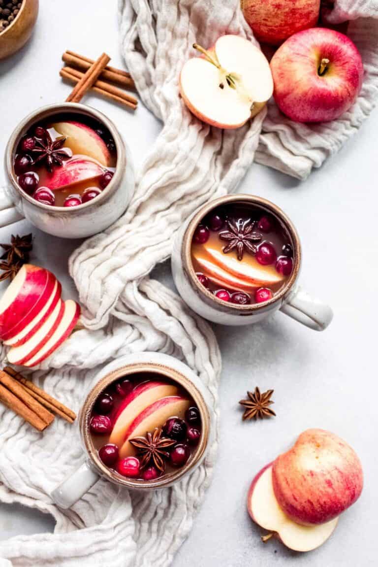 mulled apple cider in three mugs