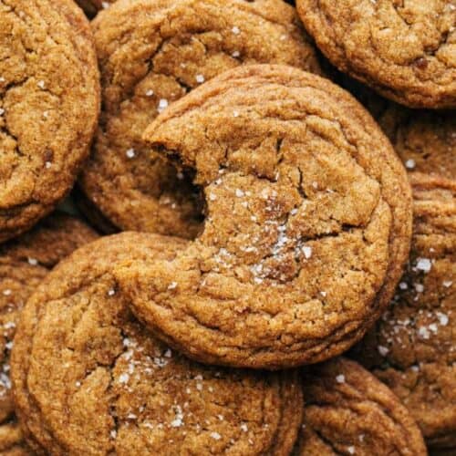 chewy pumpkin cookies stacked together with a bite taken out