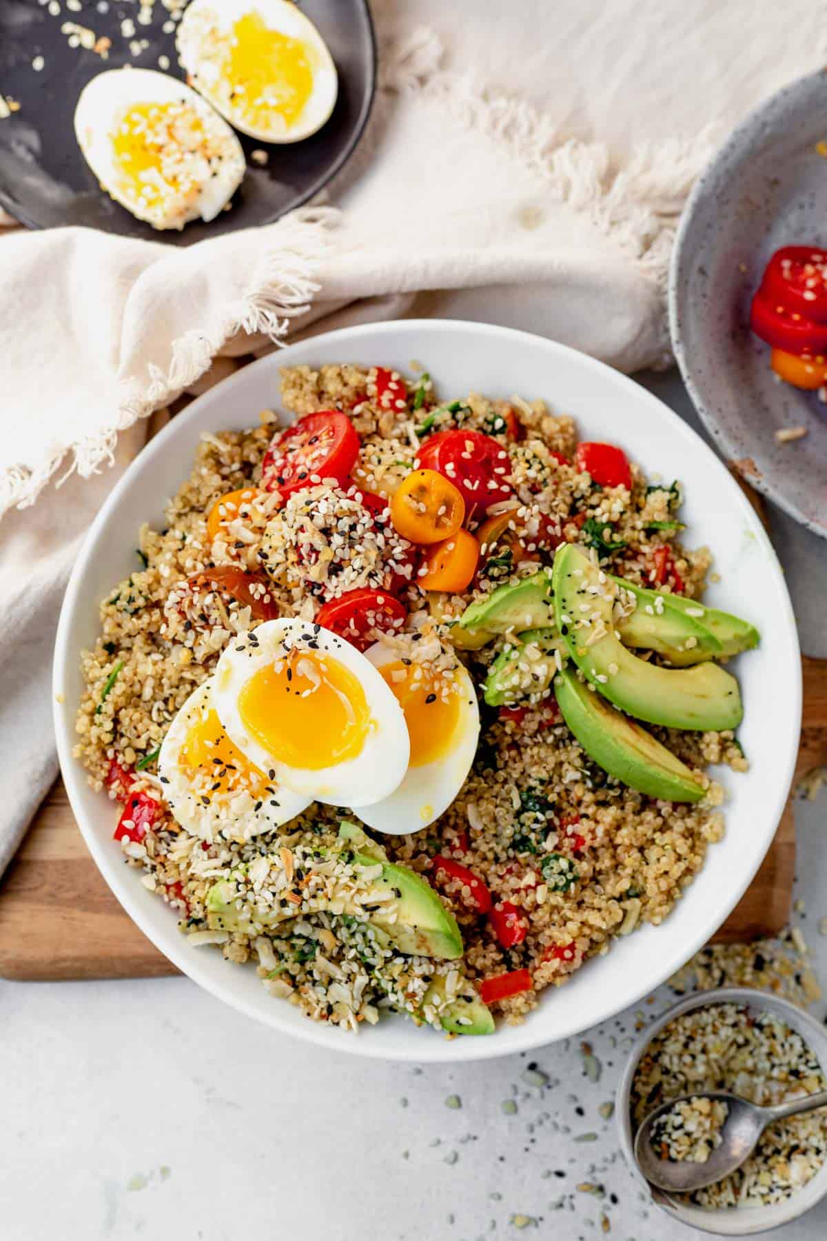 quinoa breakfast bowl with eggs and avocado