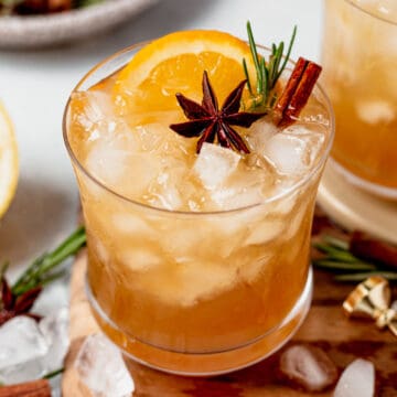 bourbon smash in a glass with crush ice and fresh herbs