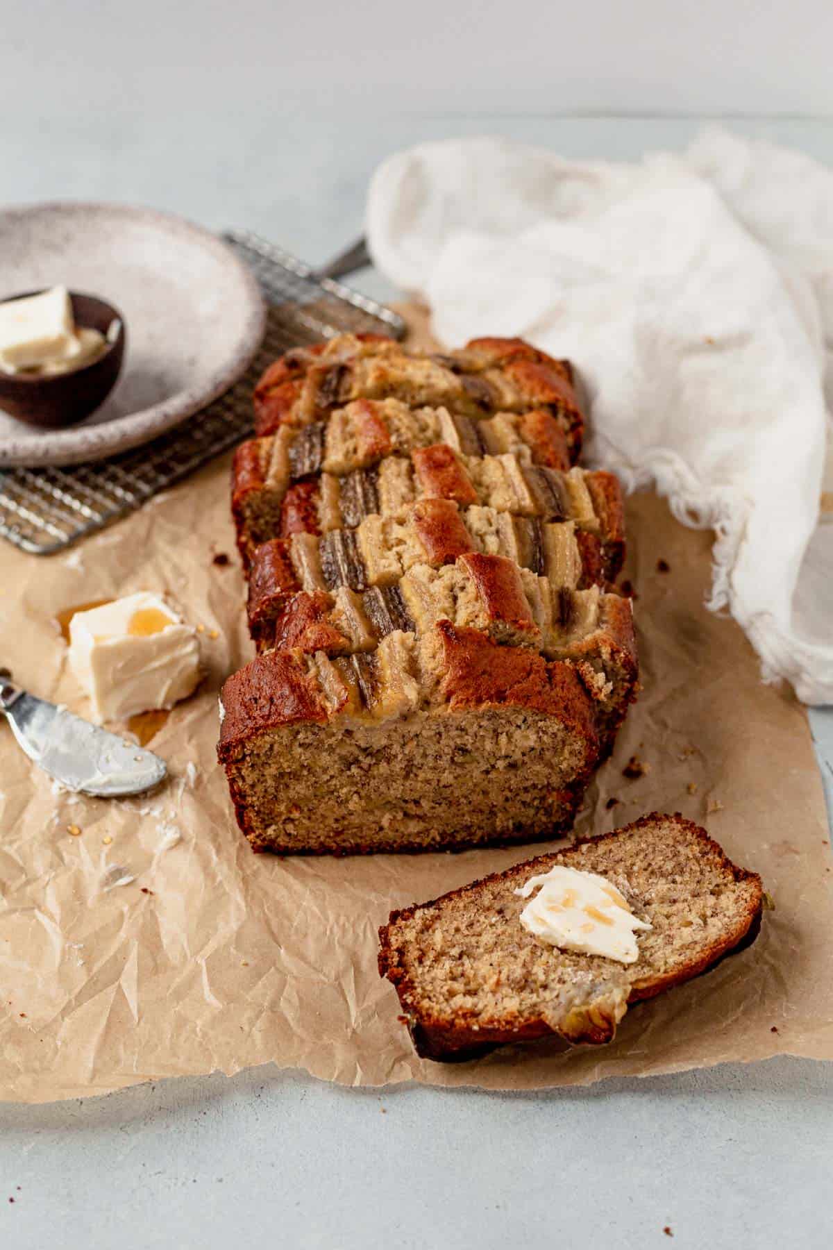 a loaf of browned butter banana bread sliced into pieces