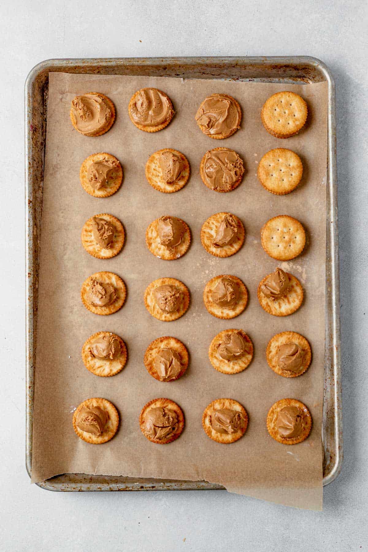 ritz crackers with peanut butter balls on top