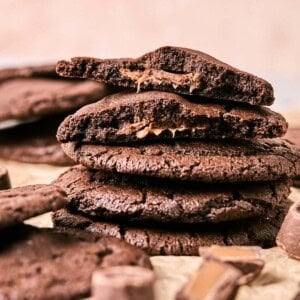 a stack of rolo cookies on parchment paper.