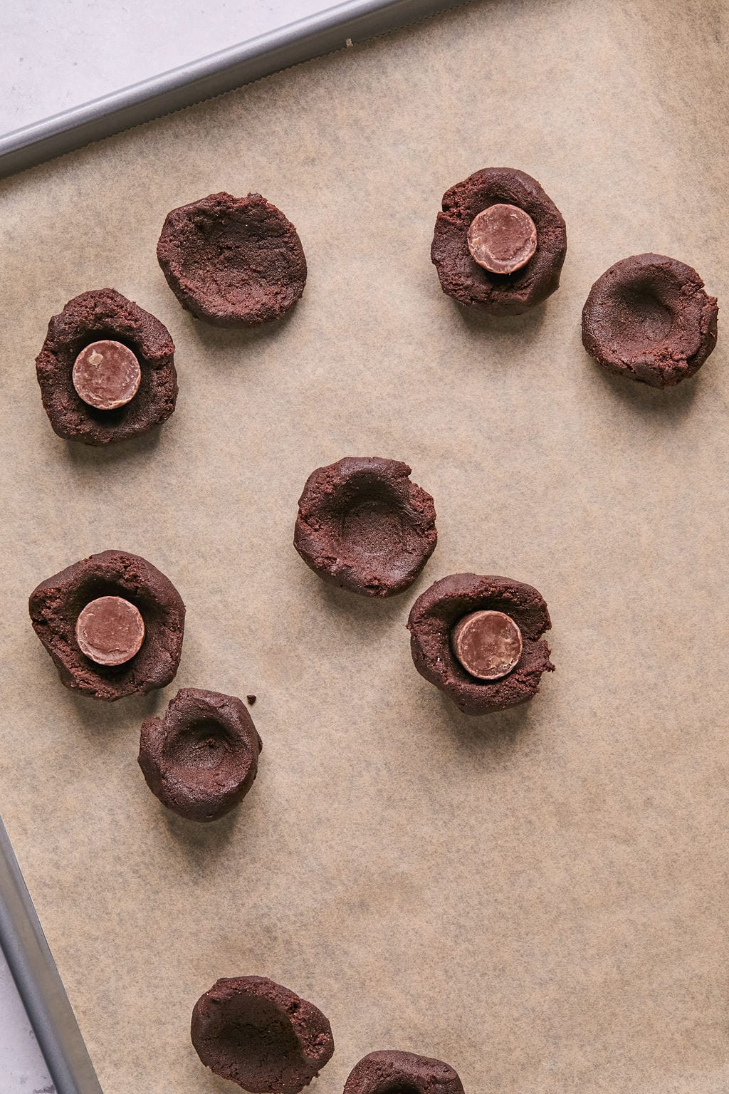 stuffing rolos into chocolate cookie dough.