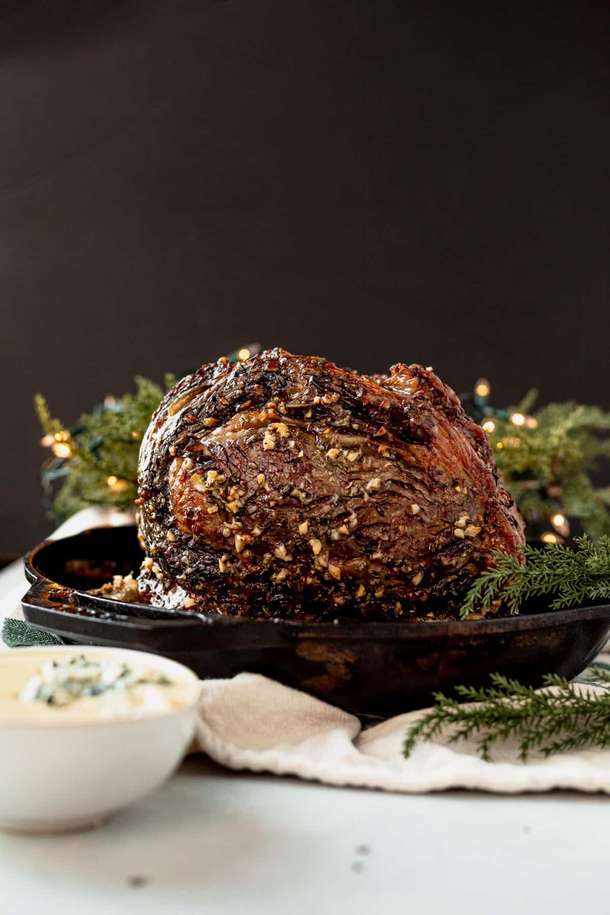 standing rib roast in a cast iron skillet