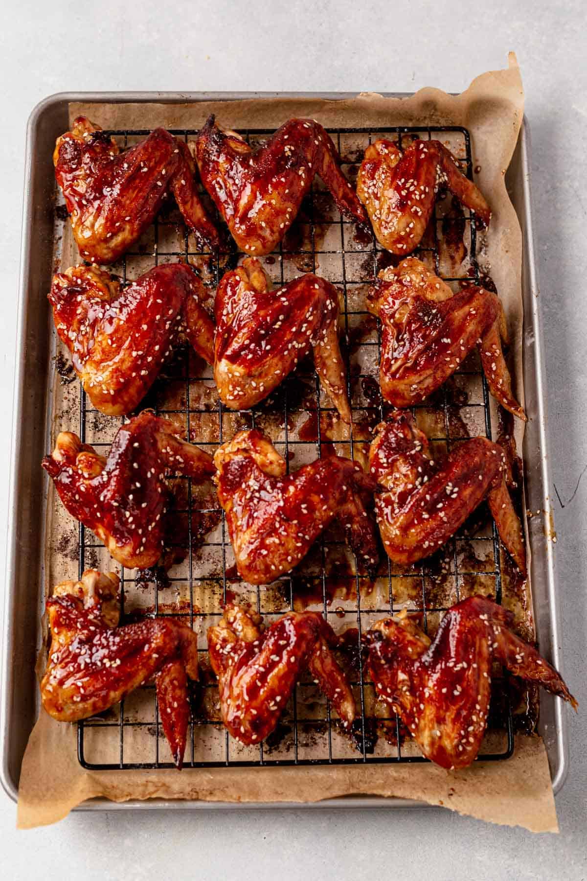 asian chicken wings cooling on a baking sheet