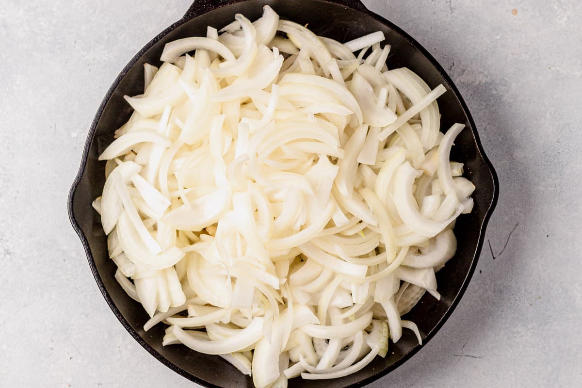 sliced sweet onions in a skillet
