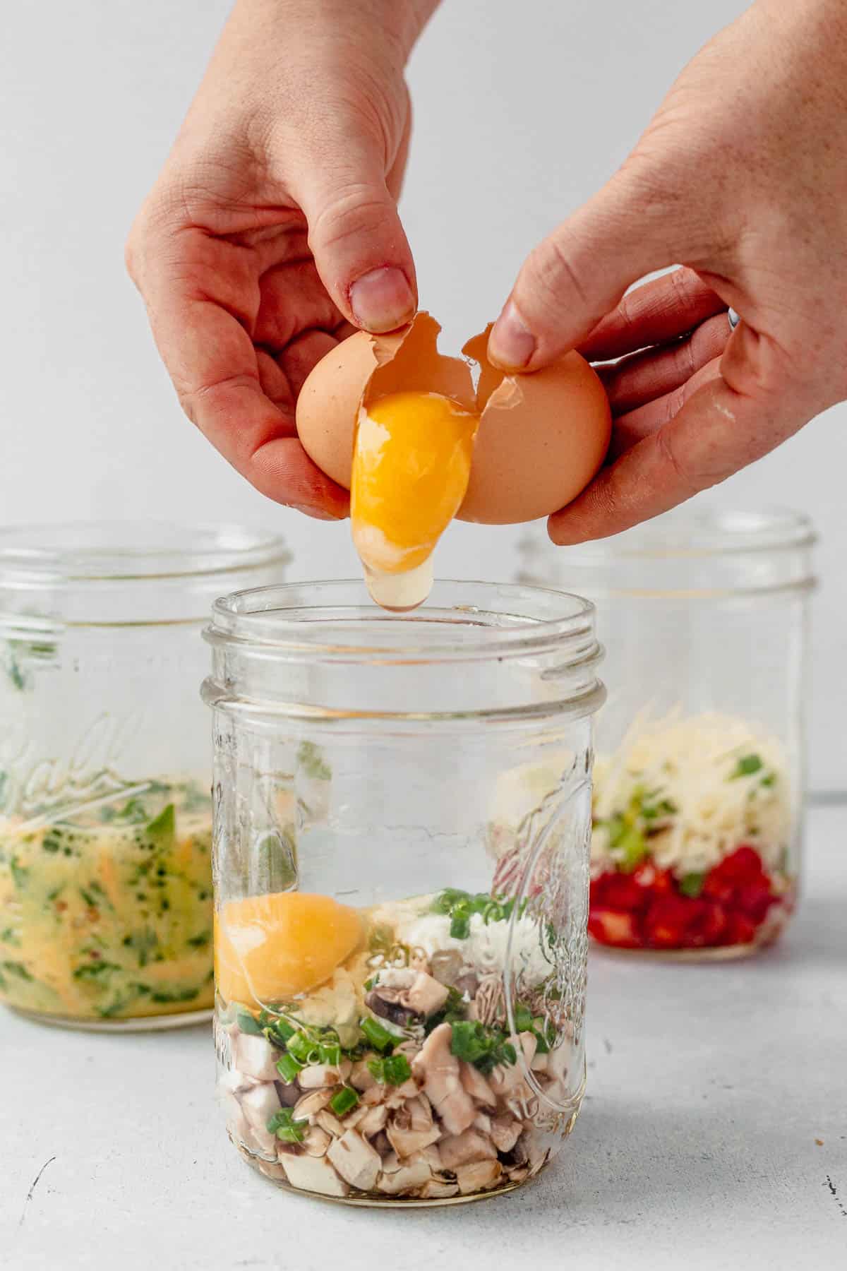 cracking an egg in a mason jar