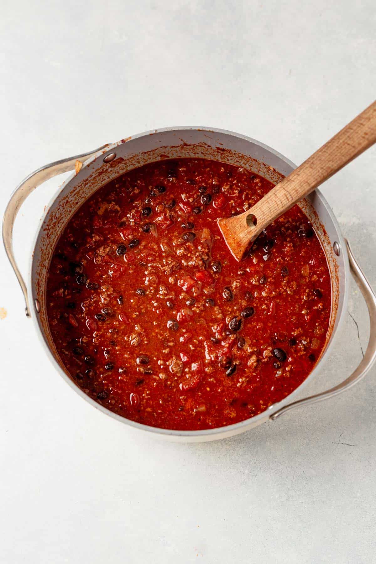 stirring sweet and spicy chili in a large pot