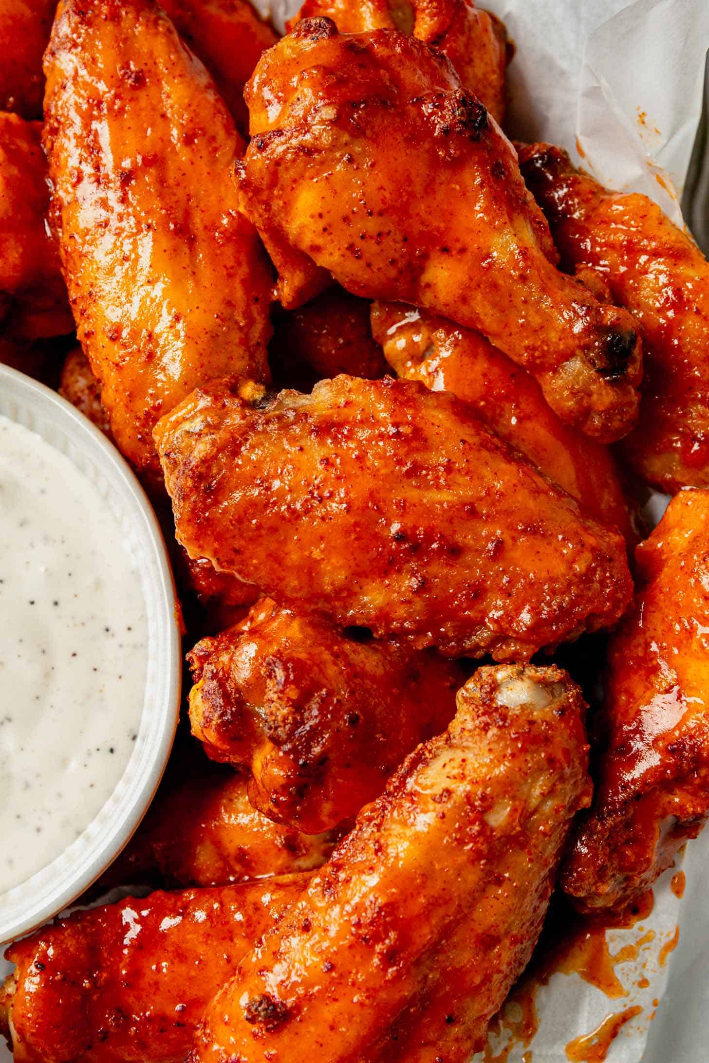 crispy baked chicken wings on a plate with ranch