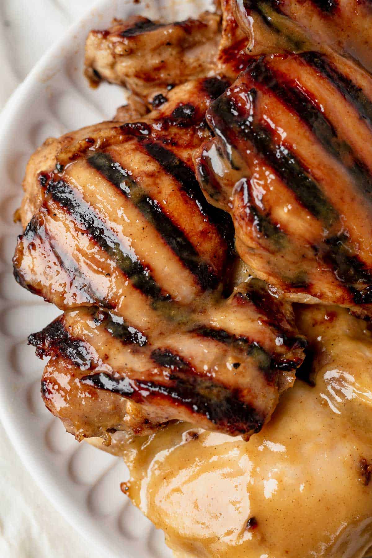 grilled and baked honey mustard chicken thighs on a plate