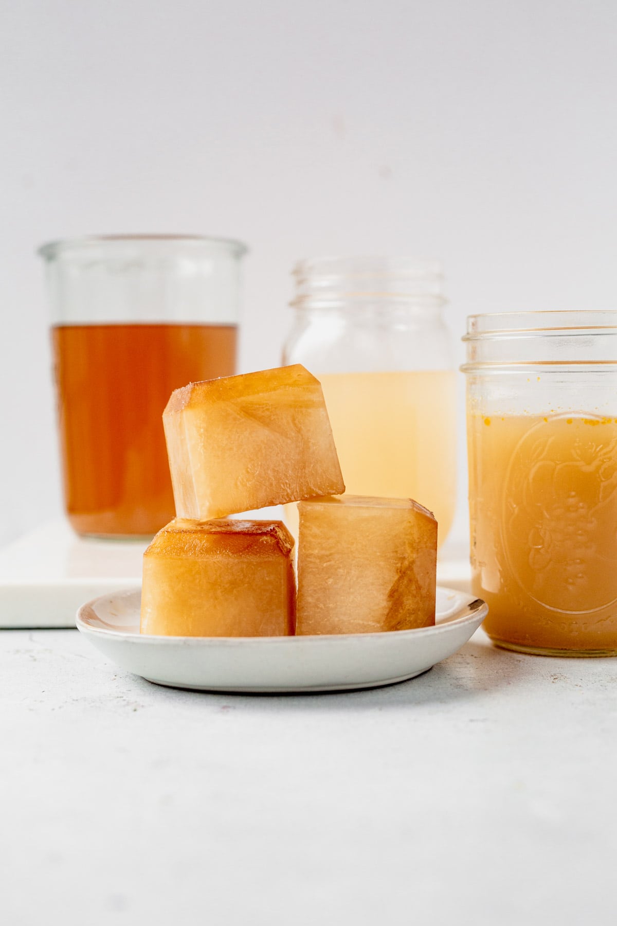 chicken broth in jars and frozen chicken broth ice cubes