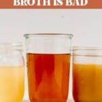 glass jars of chicken broth on a counter