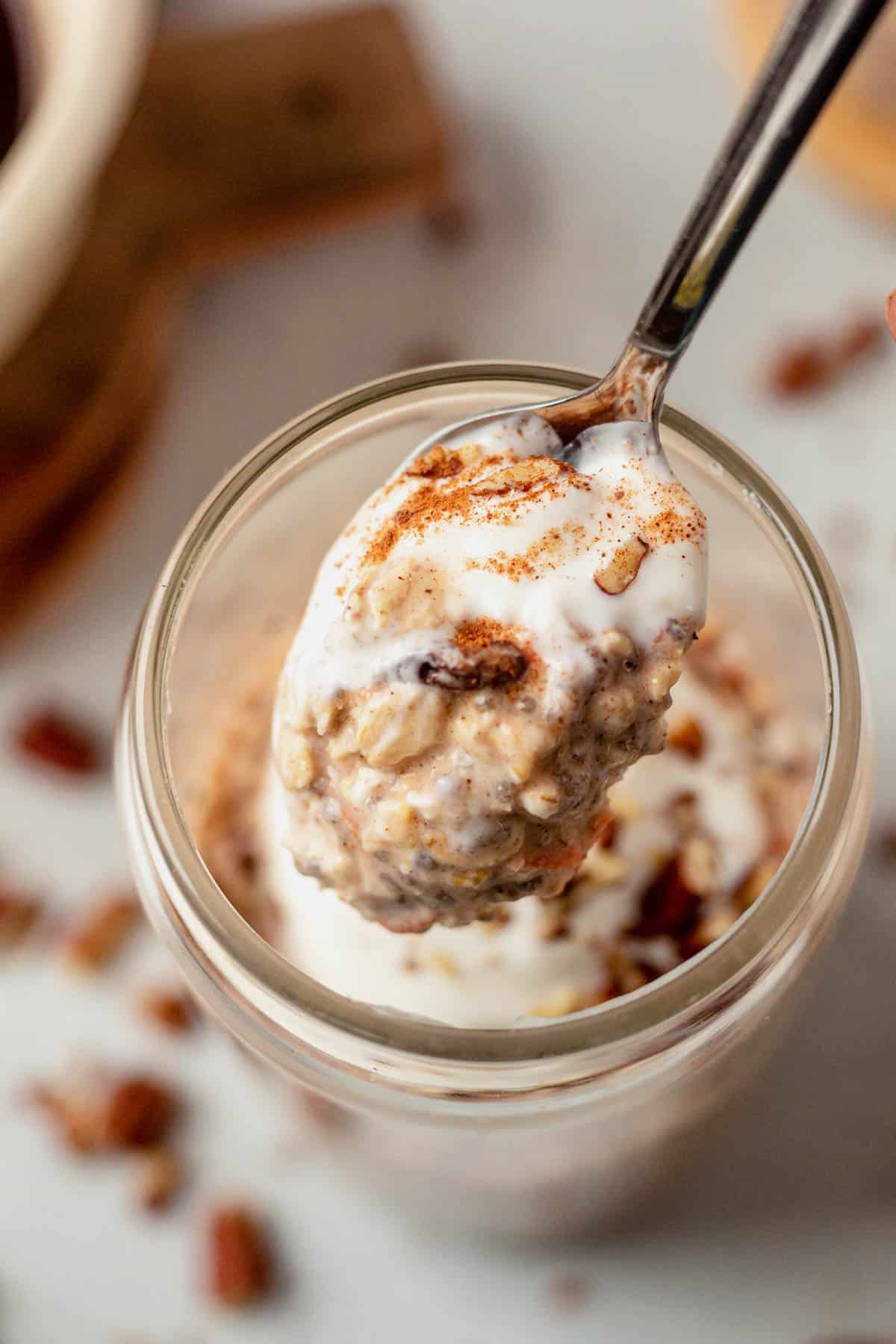 a spoonful of carrot cake overnight oats with greek yogurt