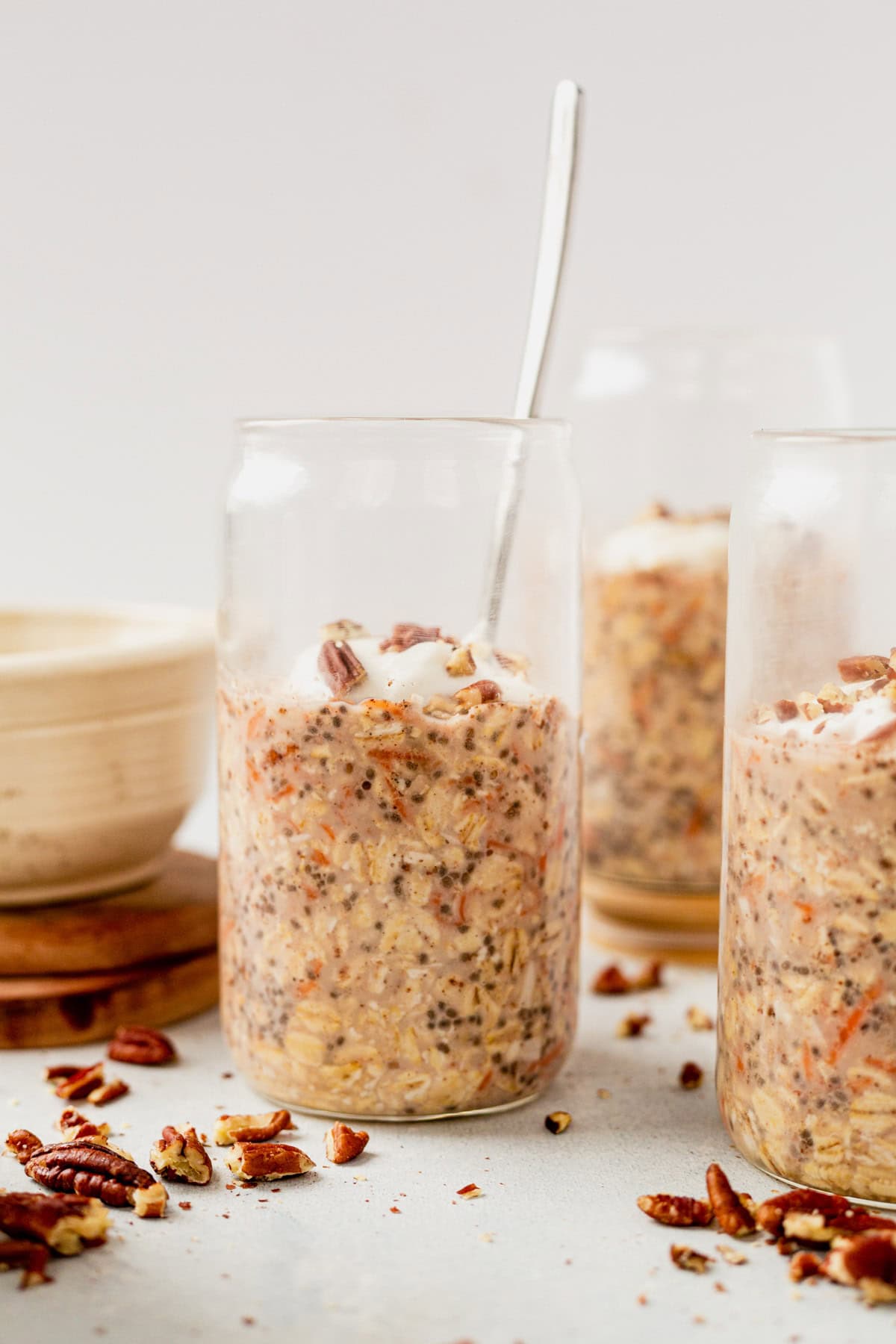 carrot cake overnight oats in a jar with a spoon.