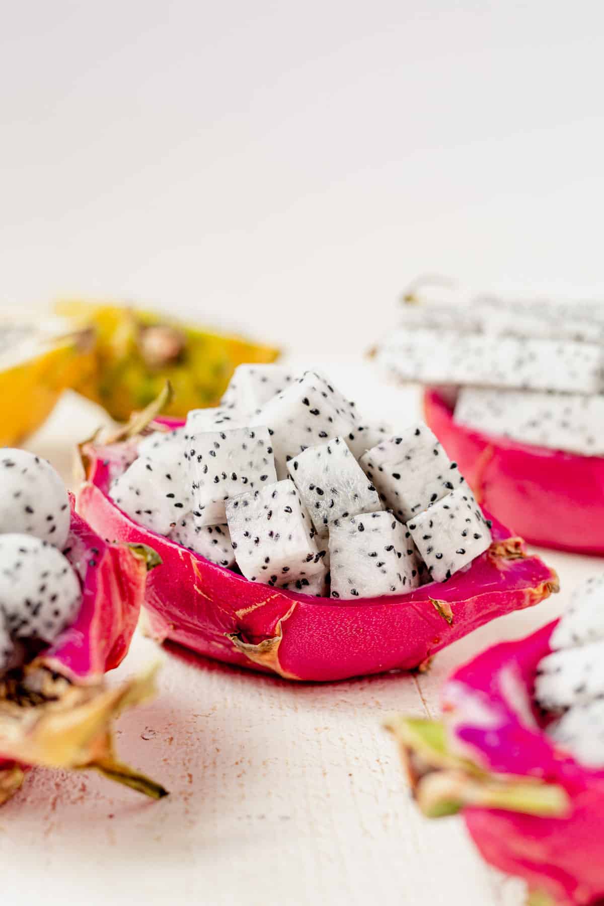 cubed dragon fruit inside the peeled skin