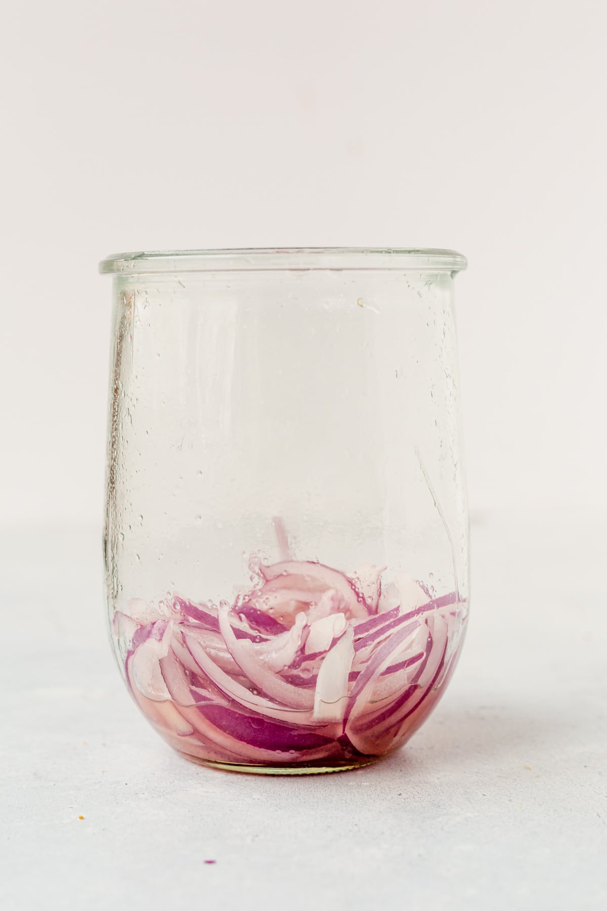 red onions with Mexican pickling liquid in a jar