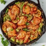 creamy lemon orzo chicken in a cast iron skillet.