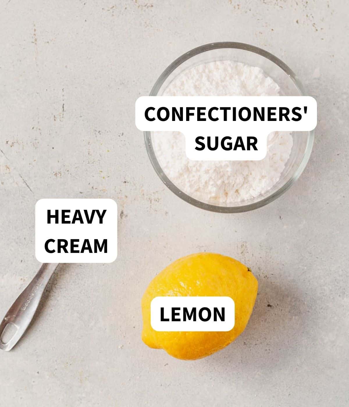 lemon drizzle icing ingredients on a countertop