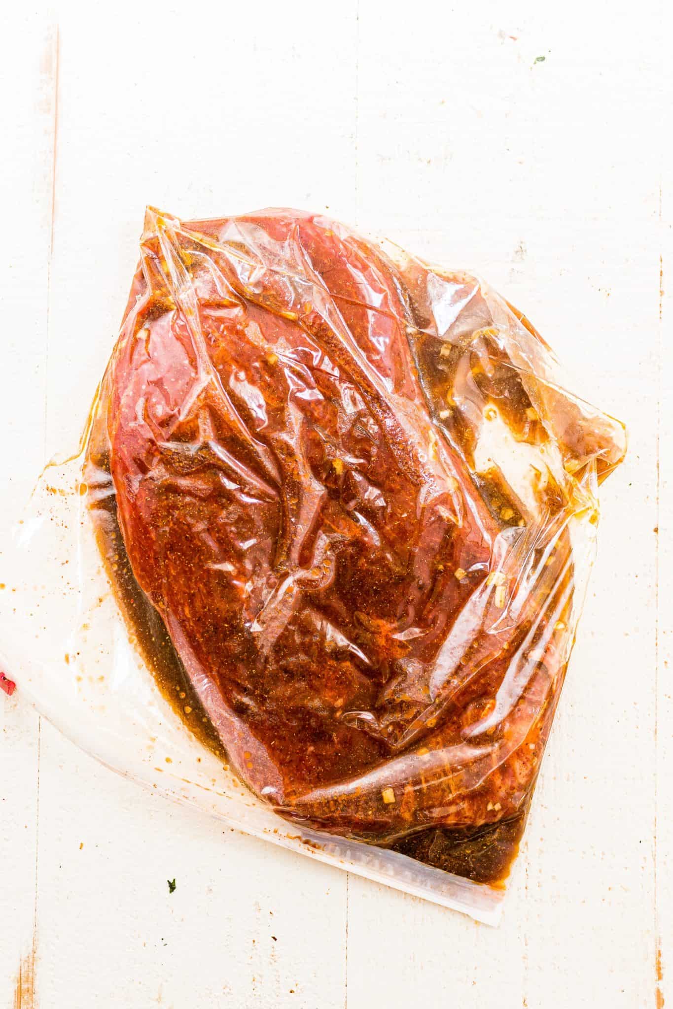 marinating flank steak in a plastic bag