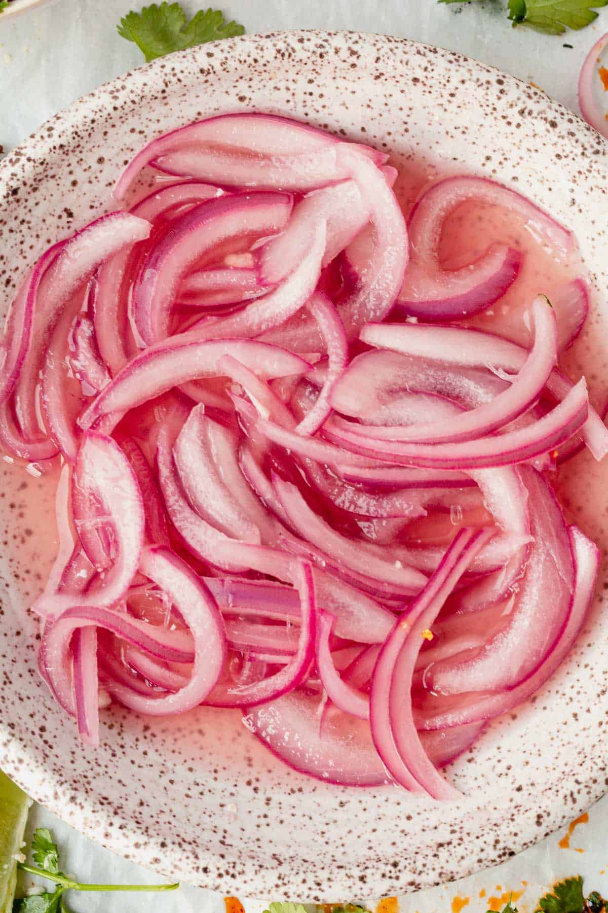 mexican pickled onions in a clay bowl