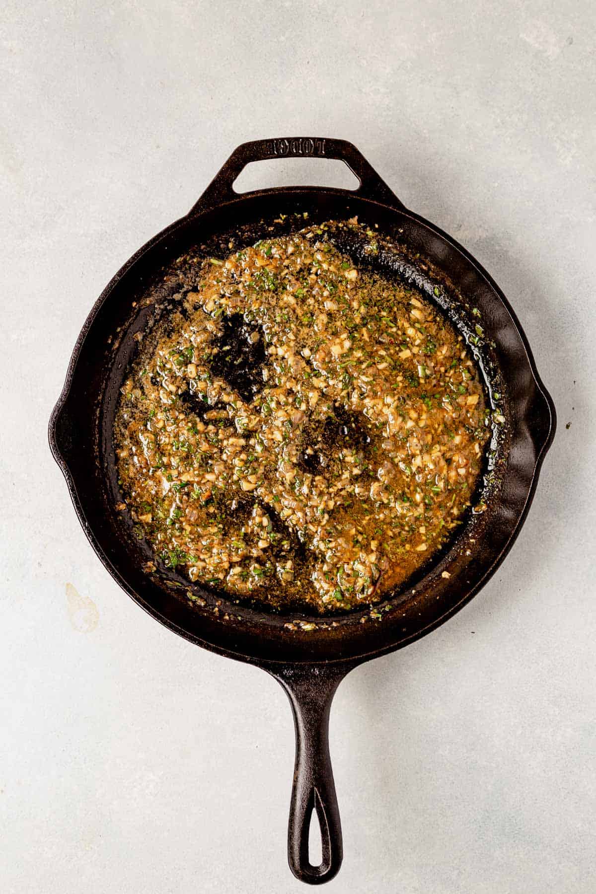 minced shallots and herbs in a skillet