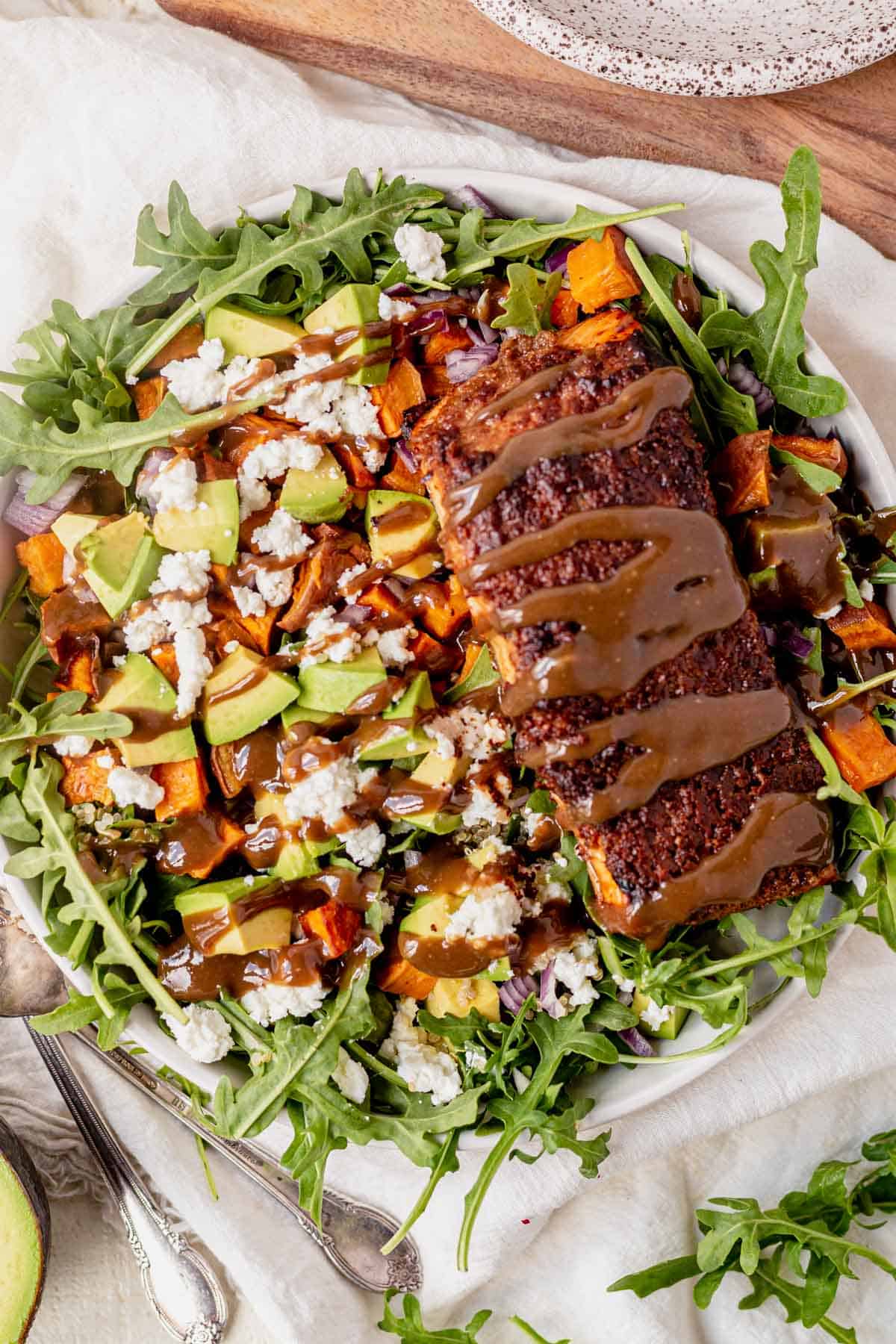 salmon arugula salad with avocado, goat cheese and balsamic dressing