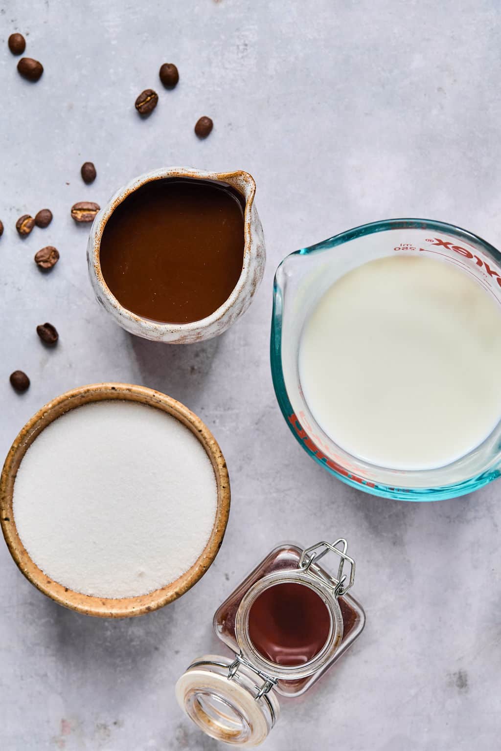 ingredients for ice caramel latte on a counter.