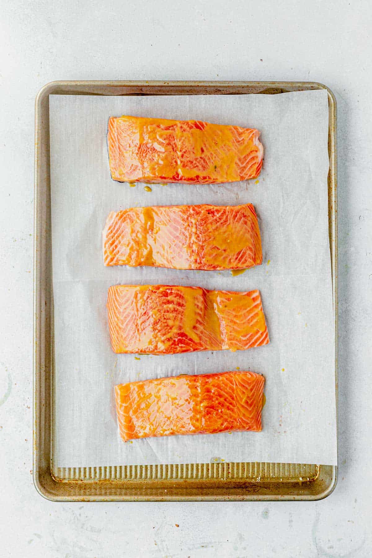 salmon filets covered in honey and dijon mustard
