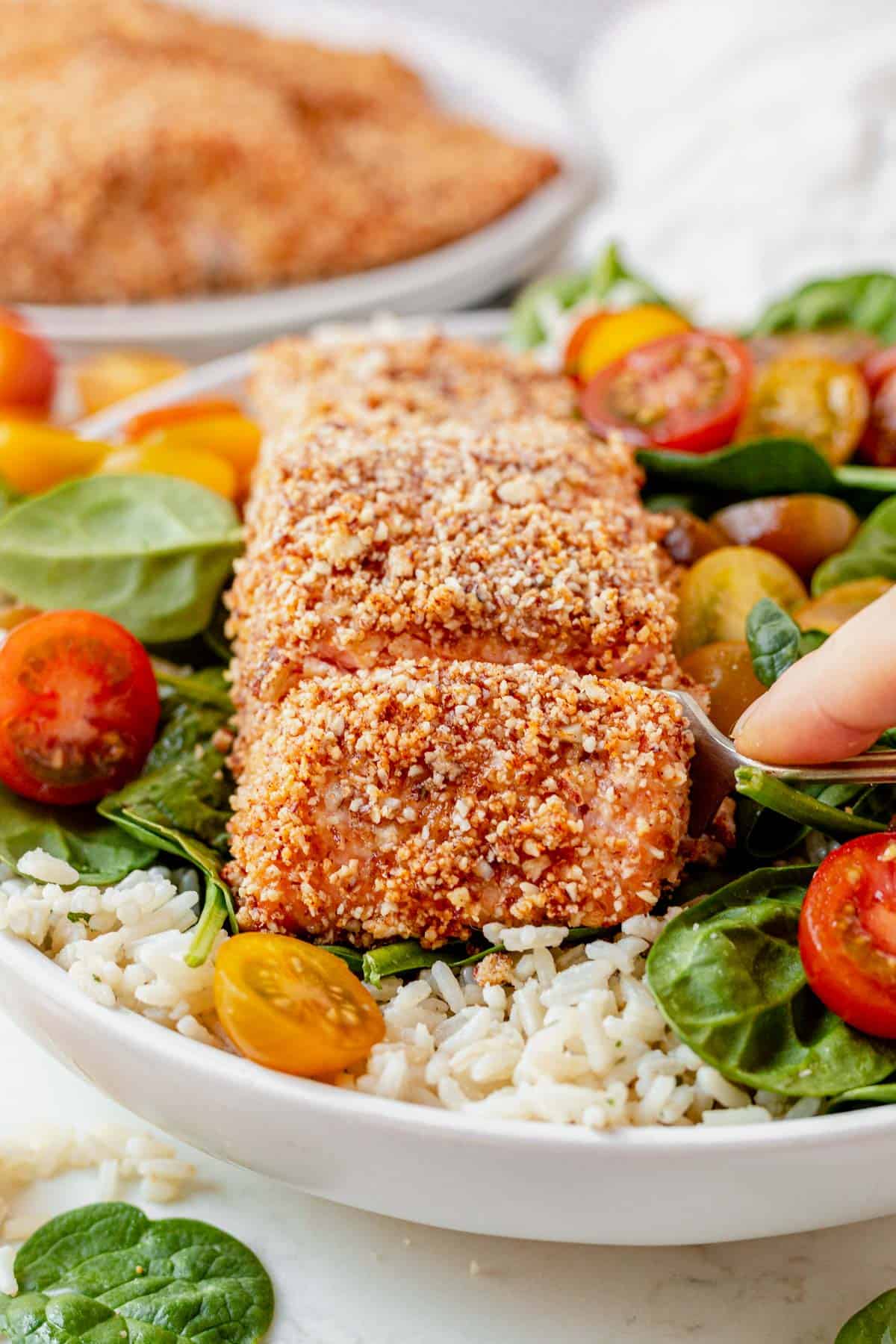 taking a bite out of almond crusted salmon