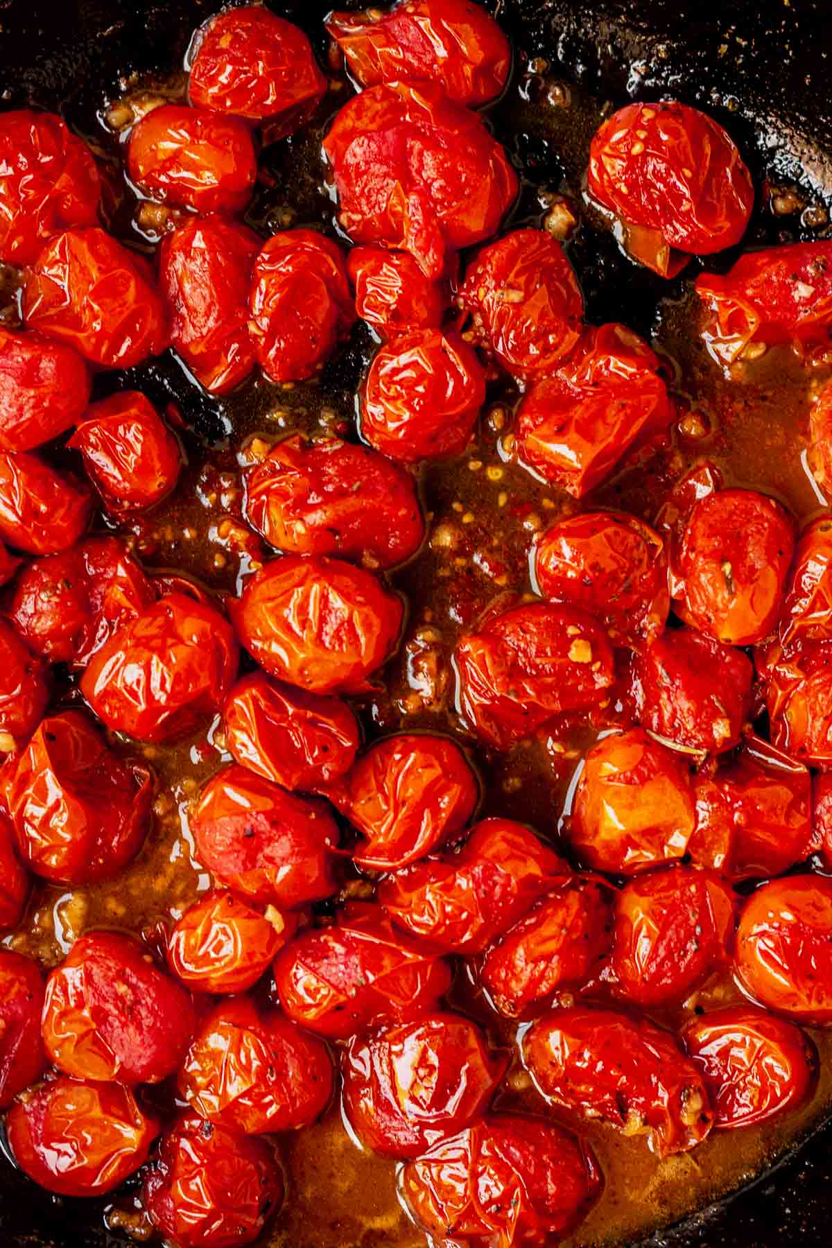 burst tomatoes in a skillet