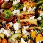 easy grilled zucchini salad with tomatoes, corn, goat cheese, and basil vinaigrette. An easy summer side dish or add grilled chicken for a weeknight dinner