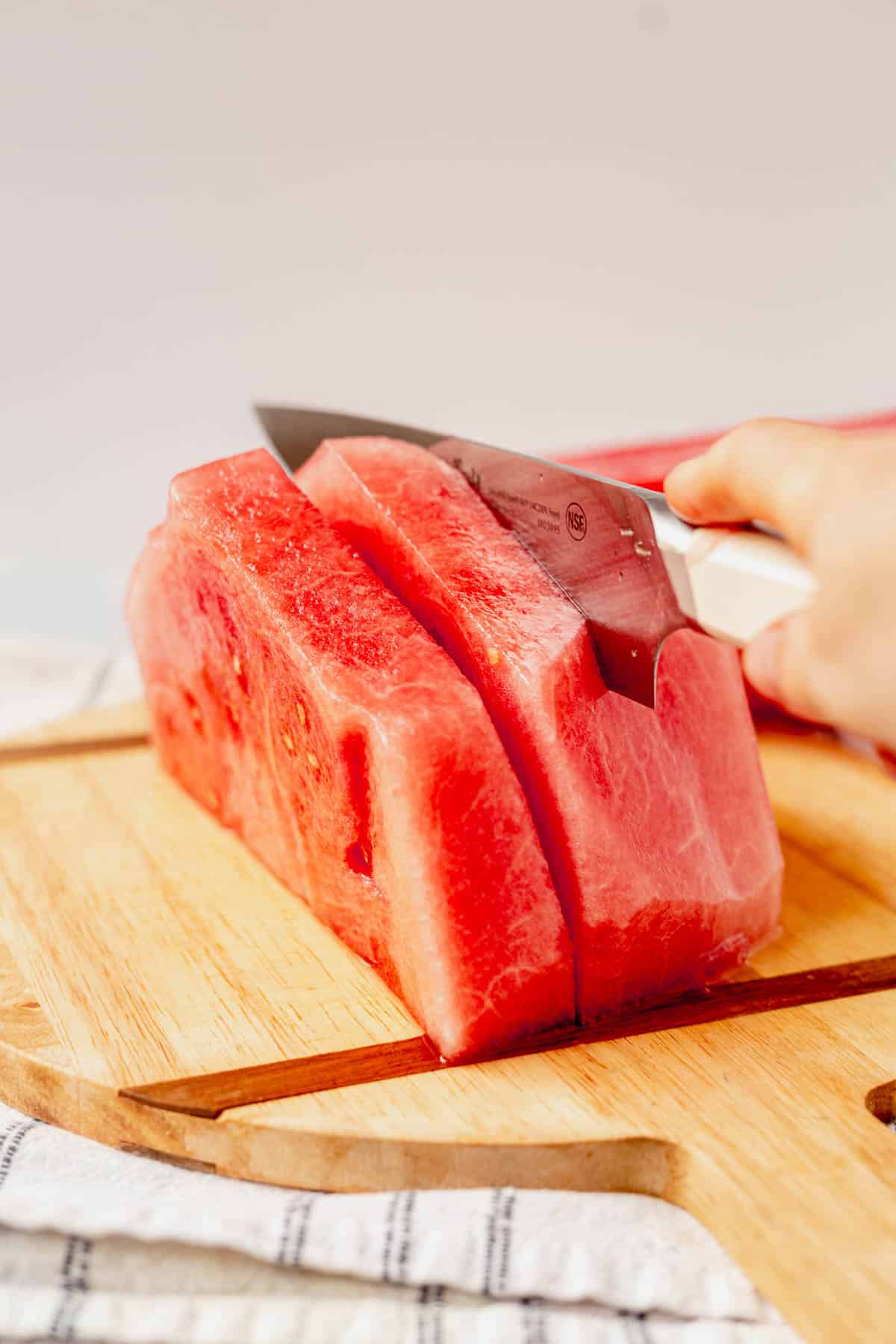 cutting watermelon into strips