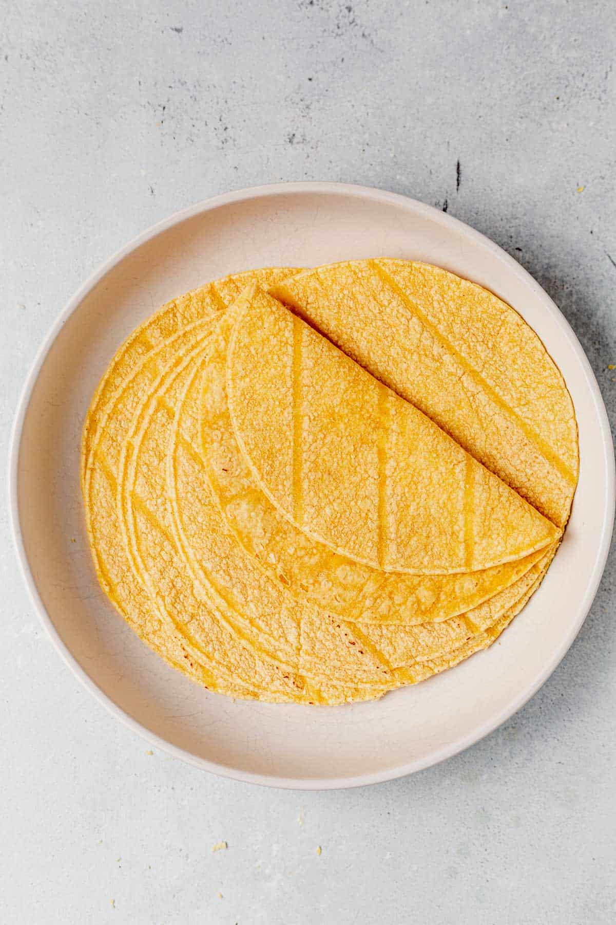 microwaved corn tortillas on a plate