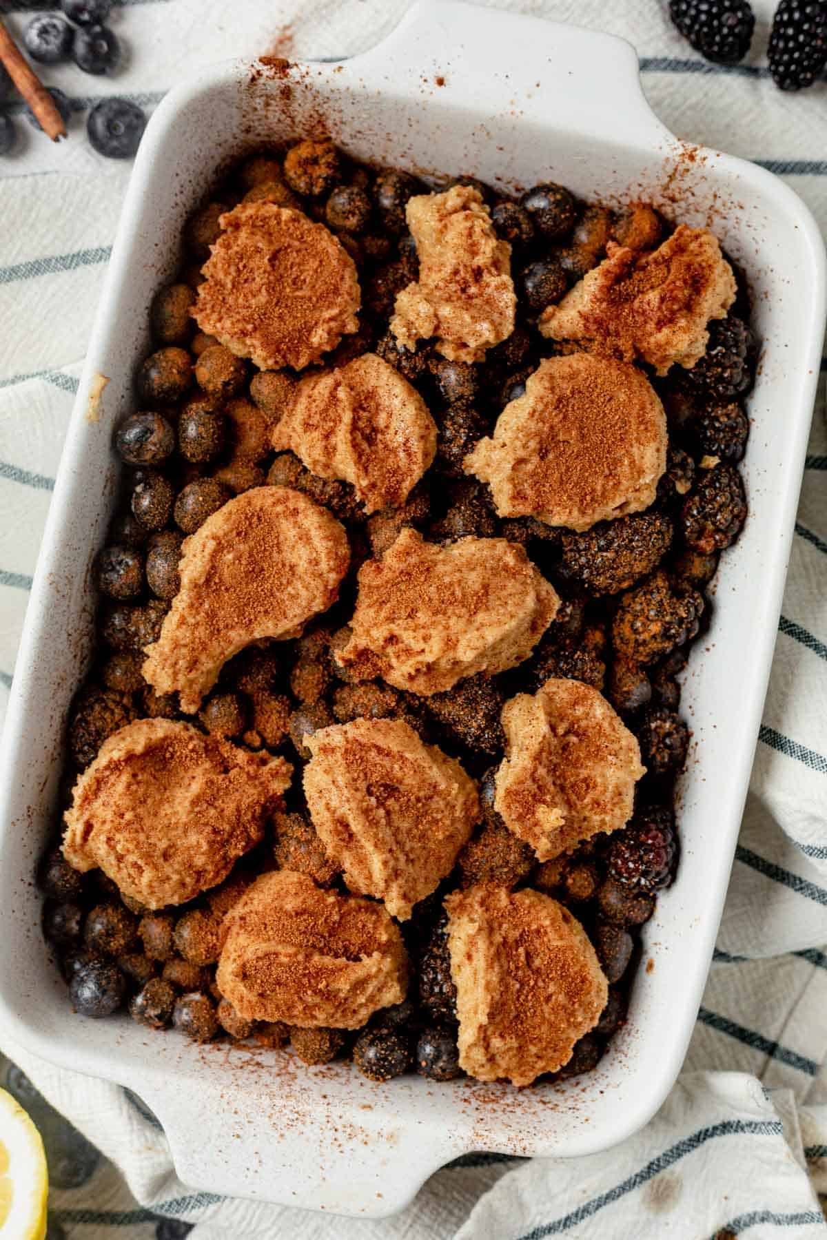 unbaked paleo berry cobbler in a baking dish