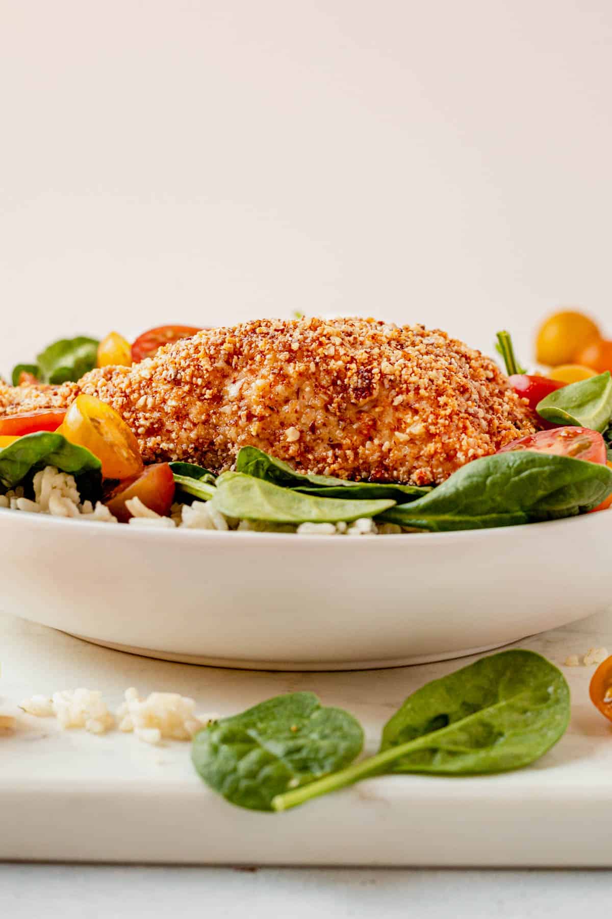 almond crusted salmon on rice and greens