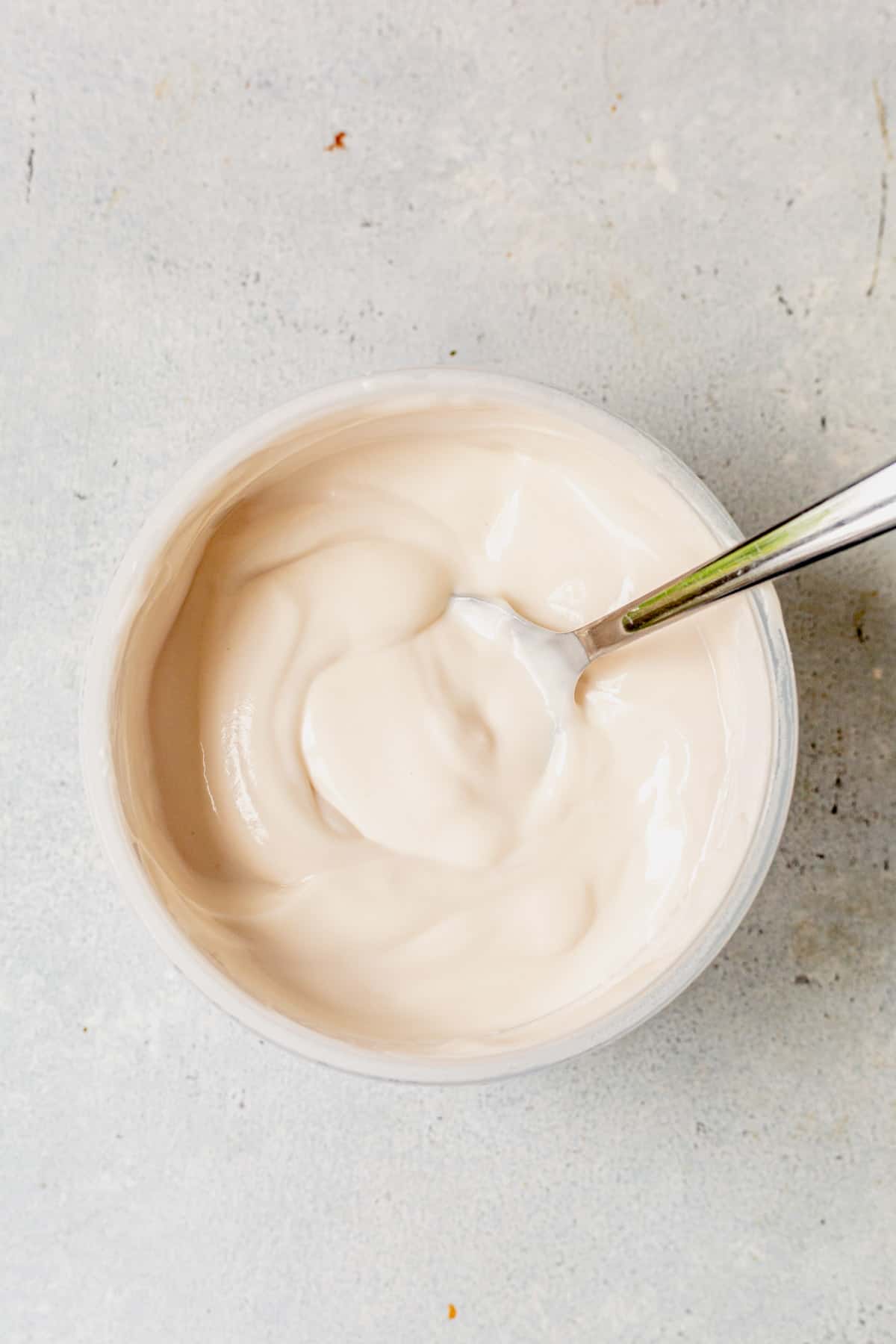greek yogurt in a bowl with a spoon