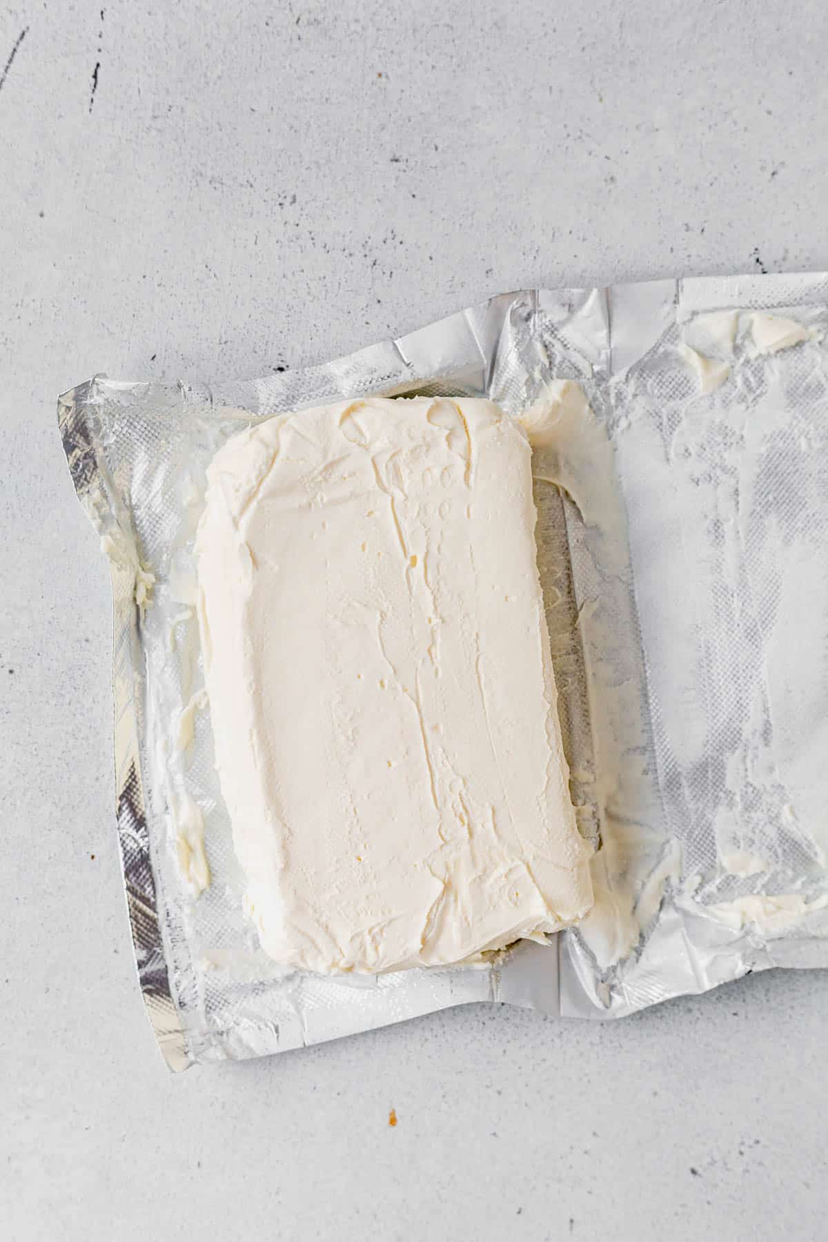 a block of cream cheese on a countertop