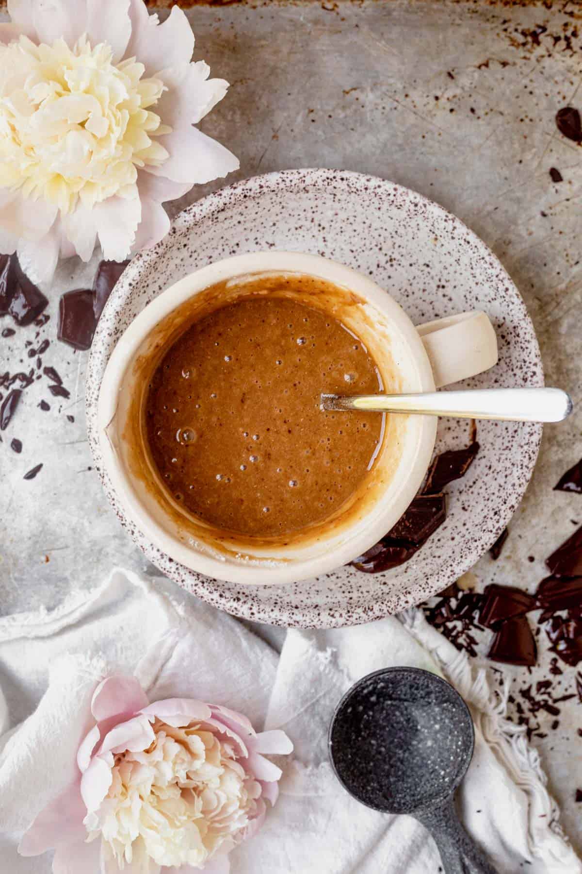 chocolate chip mug cake batter in a coffee cup