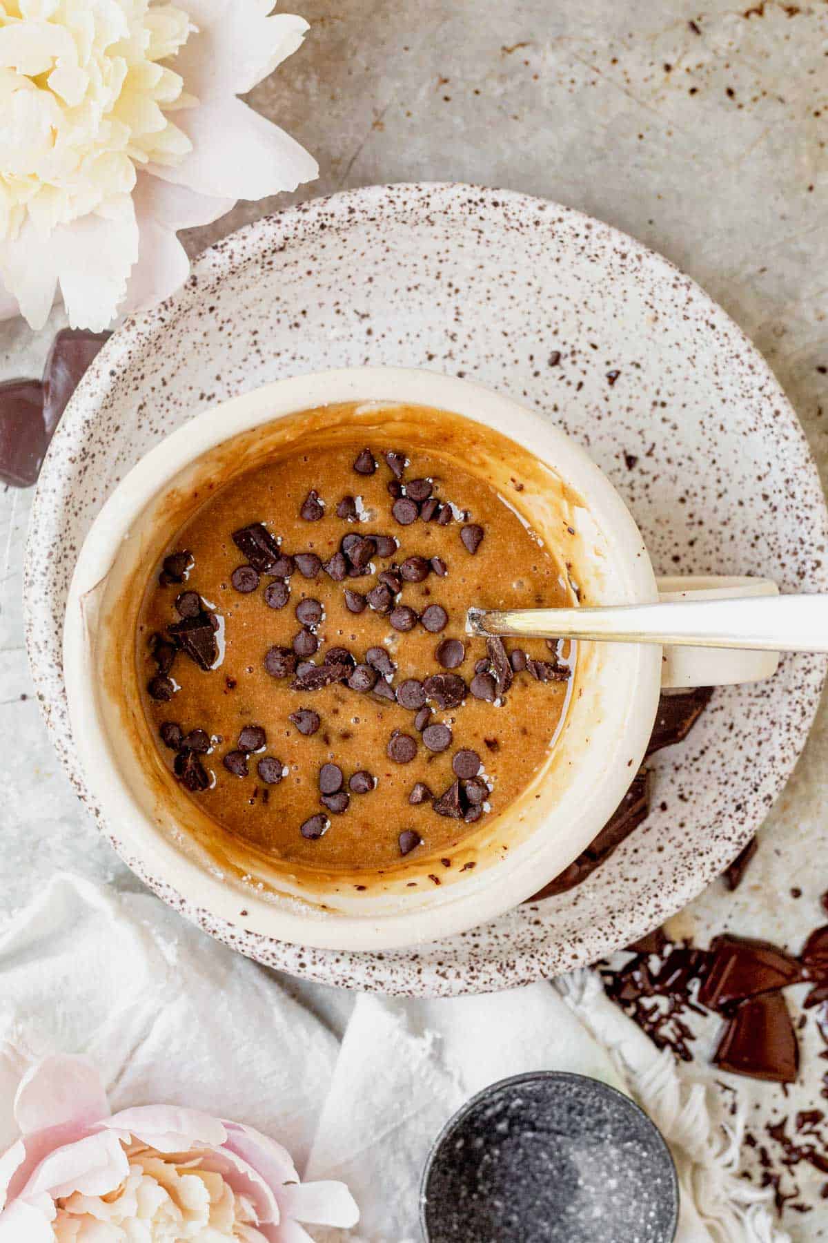 chocolate chip cake batter in a coffee mug