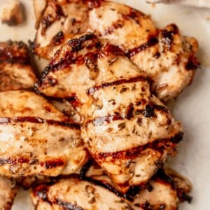 boneless grilled chicken thighs on a plate