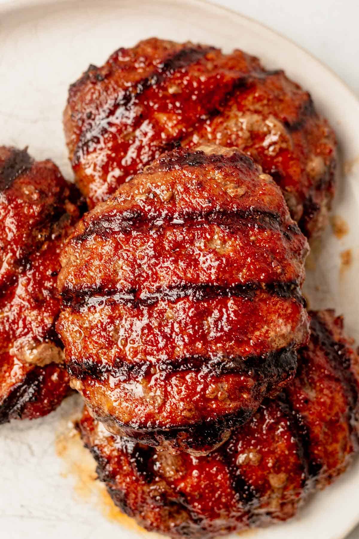 grilled burgers resting on a plate