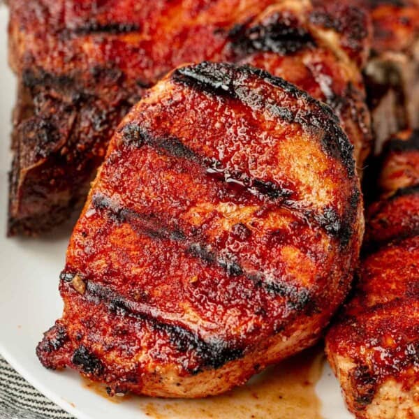 grilled pork chops on a serving platter