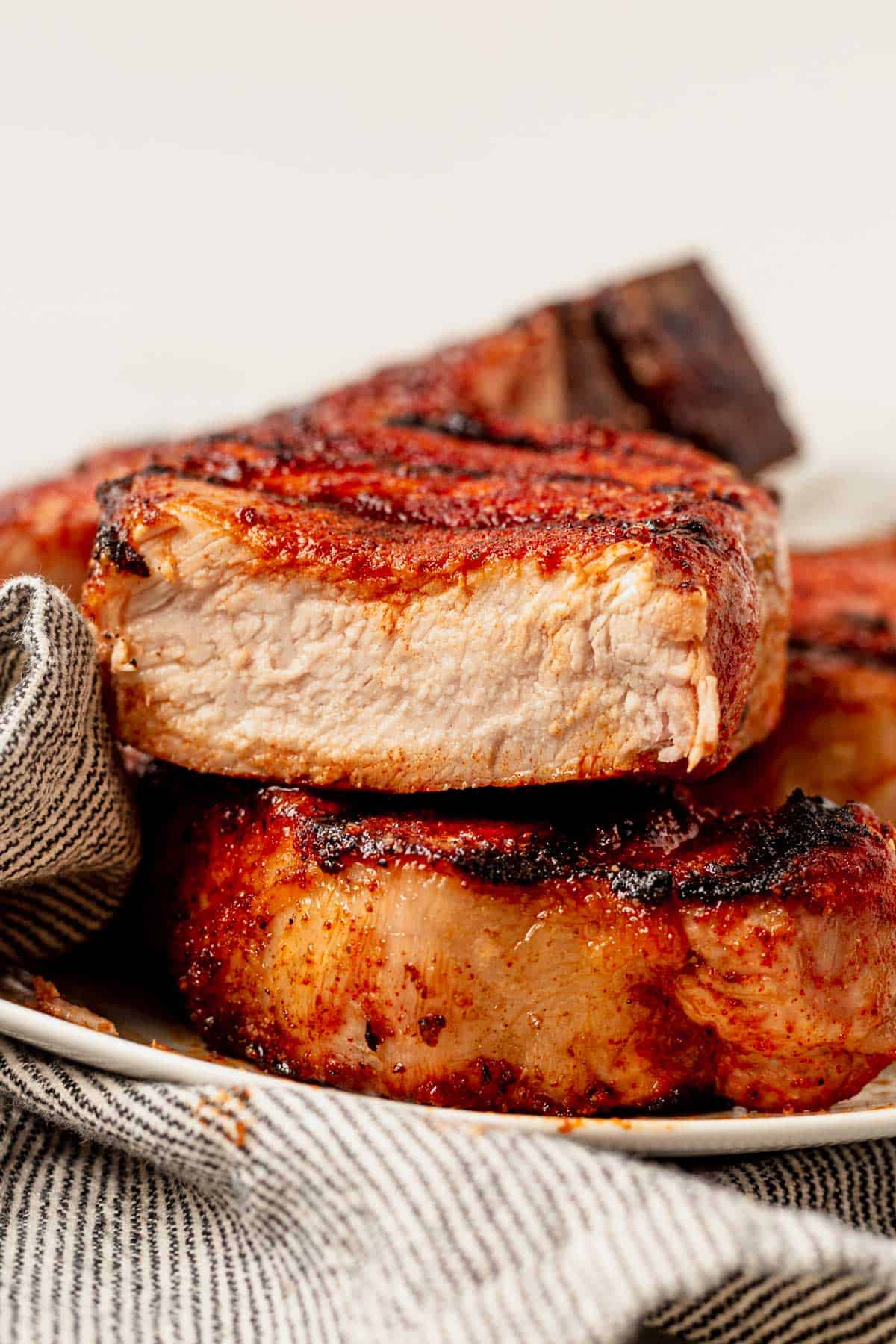 a juicy grilled pork chop cut in half