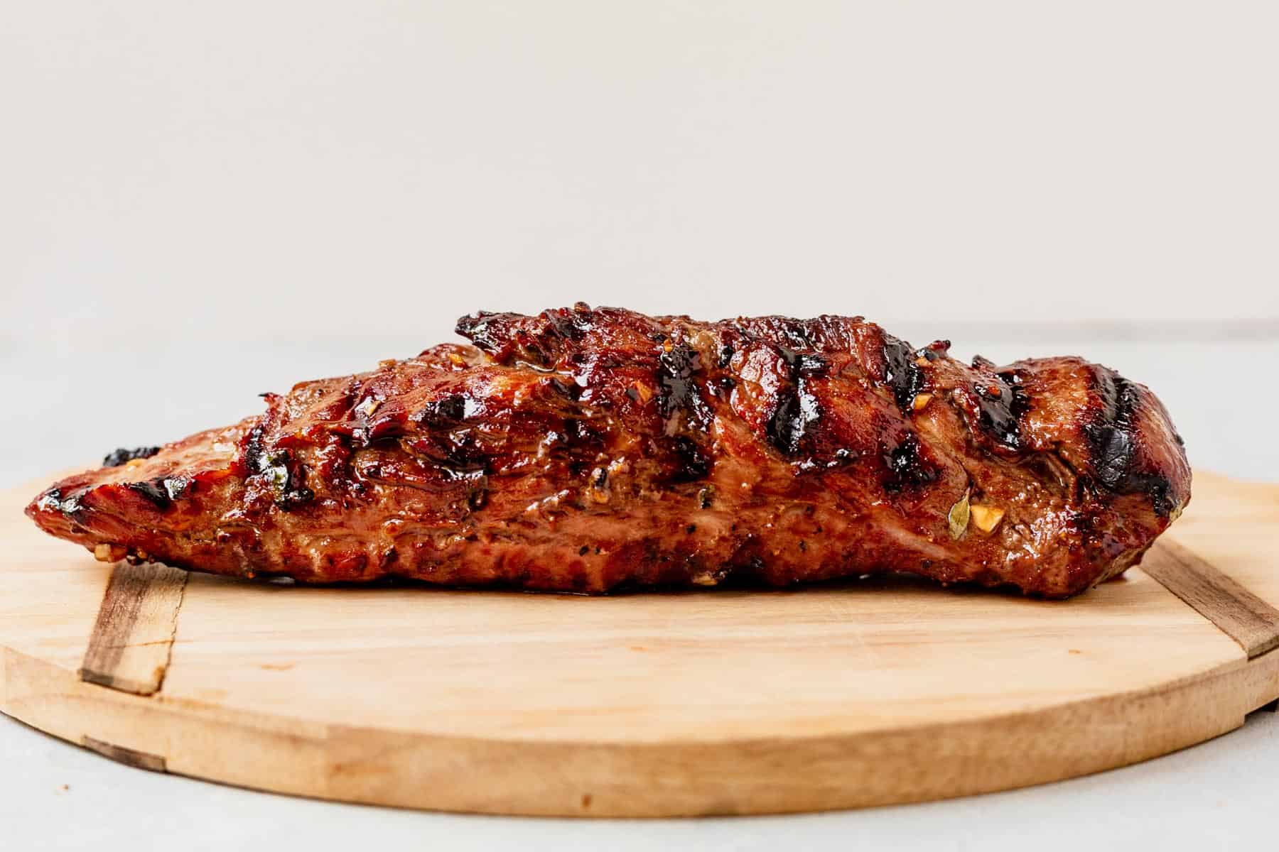 grilled pork tenderloin resting on a cutting board